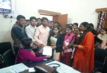 Students give a protester letter to director